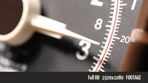 Close Up of Moving Arrow on Black Meter