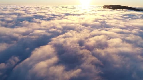 Sunrise Above Clouds: Golden Aerial View