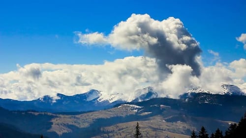 Scenic Snowy Mountains Under Blue Sky With Clouds