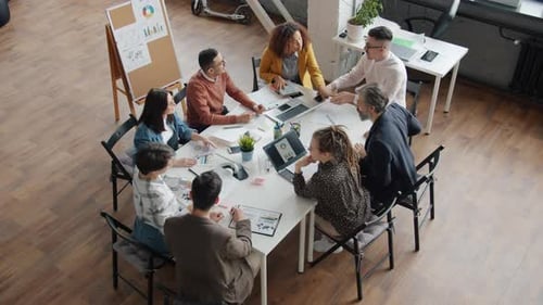 Slow Motion of Men and Women Colleagues Joining Hands Then Applauding Working in Office Together