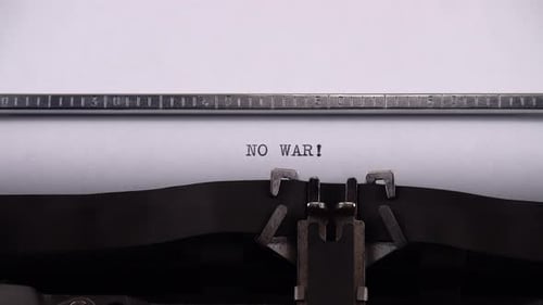 Vintage Typewriter Types the Words "No War!"
