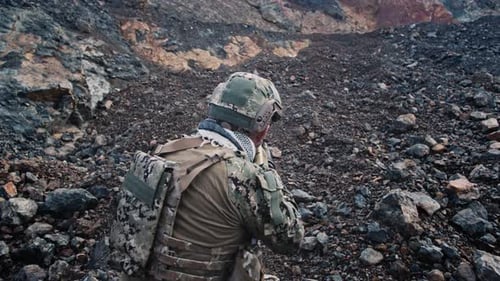 Slow Motion of Soldiers Aiming Their Assault Rifles in Mountains