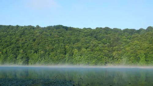 Morning fog over the river. Beautiful landscape.