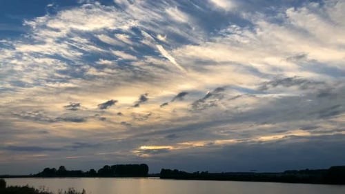 Moving clouds at sunset