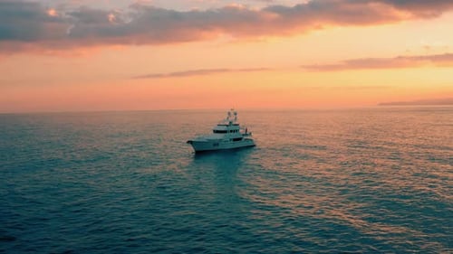 Yacht Sailing the Ocean at Stunning Sunset