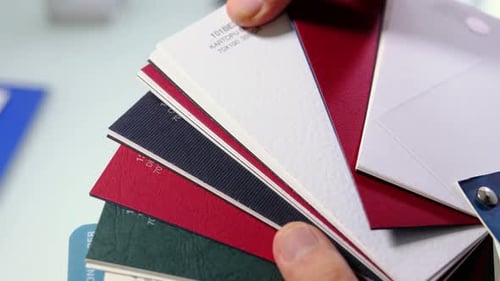 Hand holding a color sample palette close up