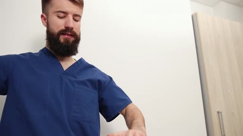 Therapist Examines Woman's Leg in Clinic