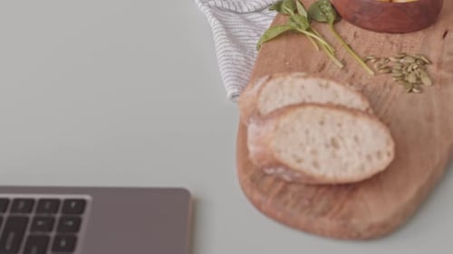 Preparing bread cheese and figs snack for lunch