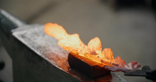 Blacksmith Forging Hot Metal on Anvil Close Up