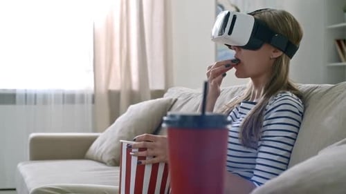 Woman Enjoys VR with Popcorn at Home