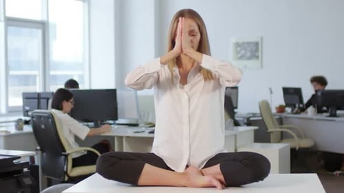 Female Office Worker Meditating