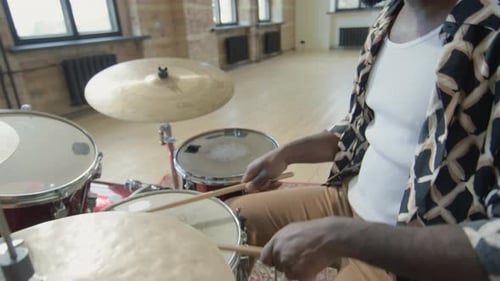 Black Musician Playing Drumset