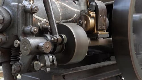 Spinning Wheel on Complex Metal Machine, Close Up