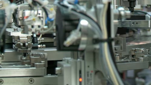 Automatic Assembly Line Machinery in Factory Setting