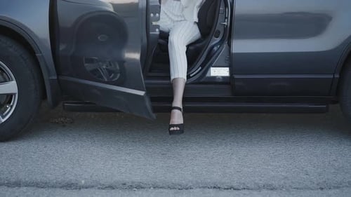 Low View of Woman in High Heel Shoes Getting Out From the Car