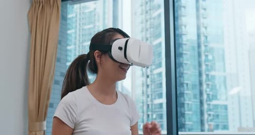 Woman Wearing VR Headset Interacting in Virtual World