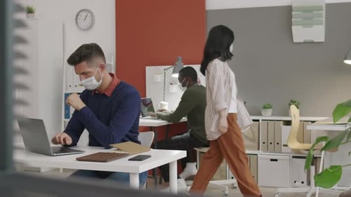 People with Masks Working in Office