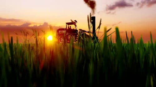 Tractor Working in the Field at Sunset
