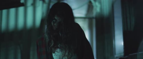 Zombie woman walking outside the building at night.Transformation zombie concept