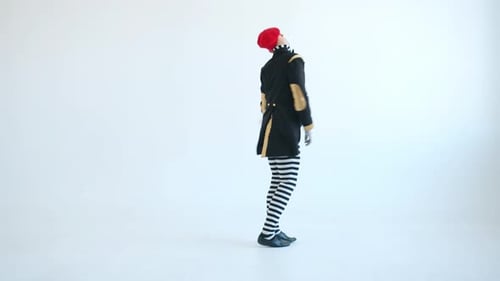 Male Mime Performer Dancing Gesturing Looking at Camera on White Background