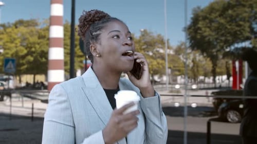 Excited African American Manager Walking Down City Street