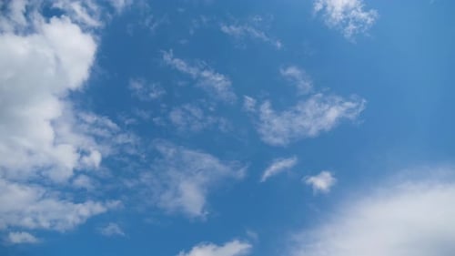 Clouds Drifting in a Clear Blue Sky