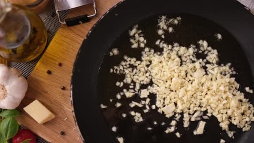 Making Pasta Carbonara Chopped Minced Garlic Into Frying Pan