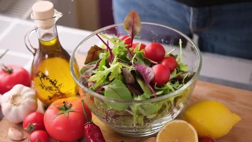 Making Healthy Salad with Fresh Vegetables and Oil
