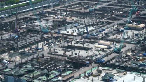 Large Construction Site with Heavy Construction Machinery in Metropolis