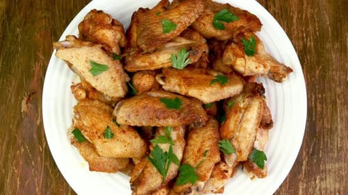 Plate of Golden Brown Chicken Wings Overhead