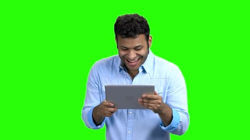 Cheerful Indian Man with Tablet Pc on Green Screen