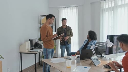Indian Programmers Brainstorming in Office