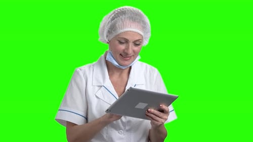 Caucasian Doctor with Digital Tablet on Green Screen.
