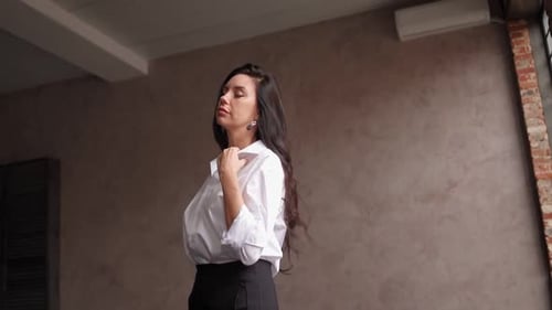 Confident Woman Posing Elegantly Indoors