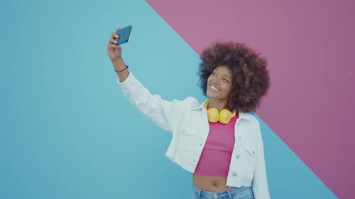 Woman Takes Selfie with Colorful Background