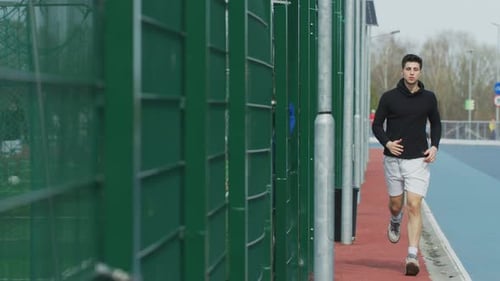 Rear view of a man running