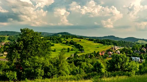 Green Valley Landscape With Dramatic Clouds