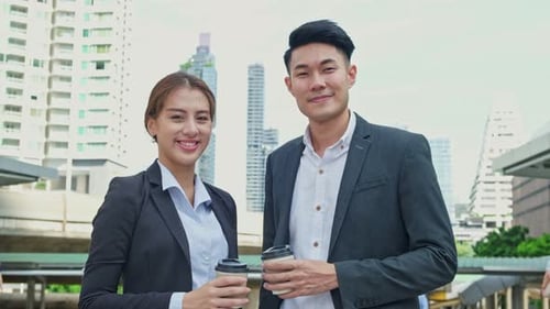 Asian young couple office business man and woman people stand outdoor in city with confidence.