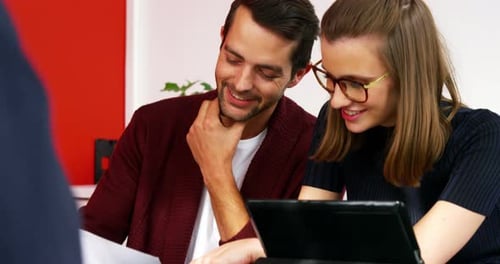 Young Adults Collaborating in an Office