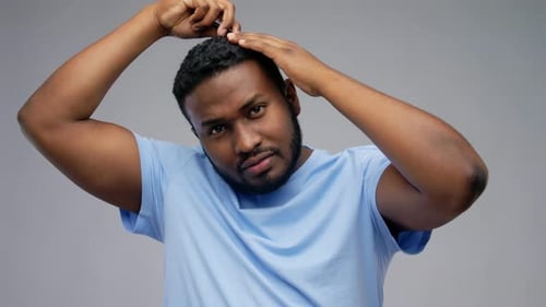 Man Combs Hair for Grooming, Hairstyle and Style