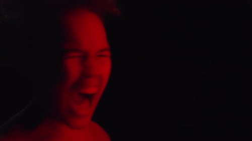 Emotional Woman Screaming in Red Lighting