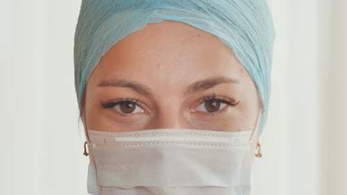 Medical Professional Wearing Face Mask and Cap