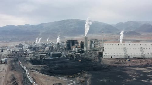Disgusting Aerial of the Dirty Industrial Site with Many Pipes Polluting Air