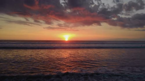 Flight at Sunset Overlooking the Indian Ocean in Bali Indonesia