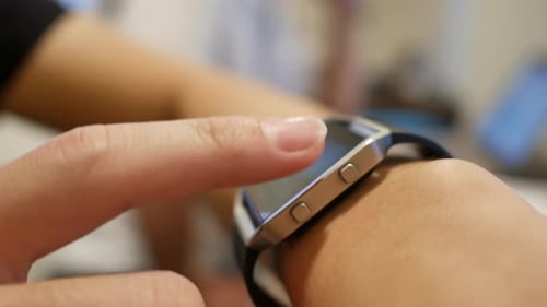 Close Up of a Person Using Smartwatch