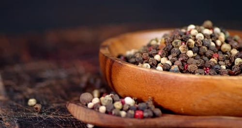 Wooden Bowl of colourful peppercorns