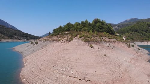 Lake with turquoise water and green trees. Landscape with rivers, forest, lake