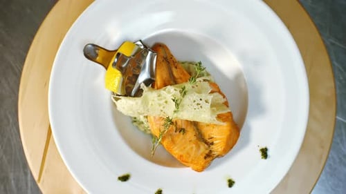 Top View of Spinning Plate with Baked Salmon Fillet