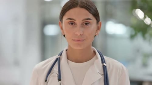 Confident Woman Doctor in Medical Coat Close Up