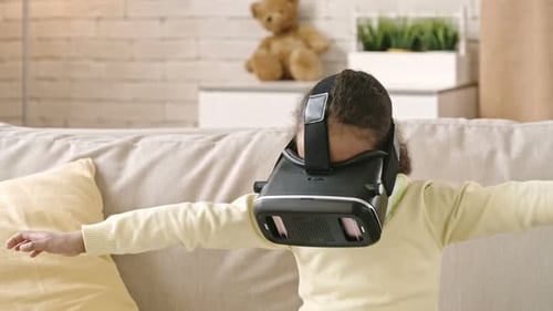Girl Experiencing Virtual Reality with VR Headset